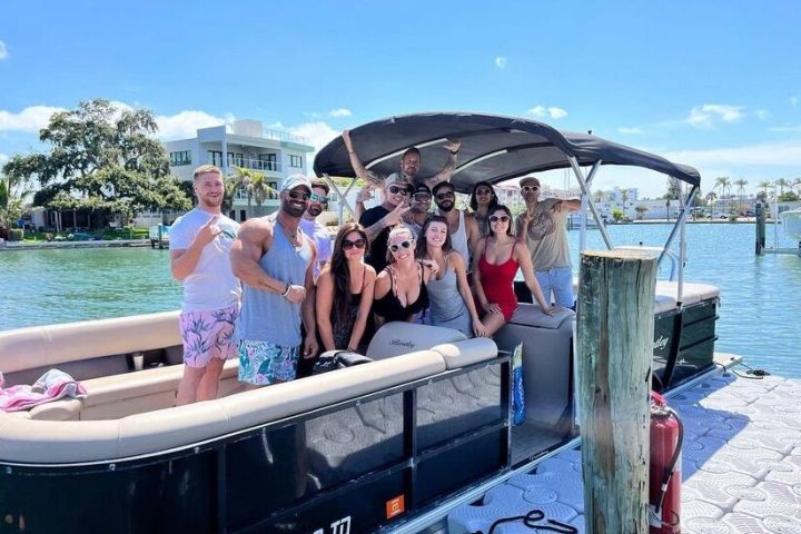 a group of people on a boat in the water