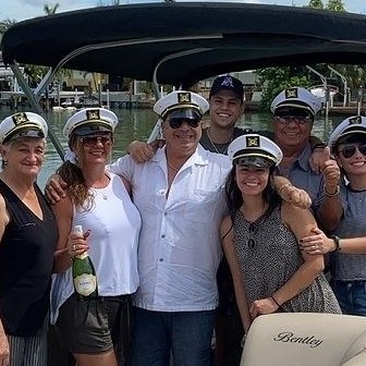 a group of people on a pontoon boat